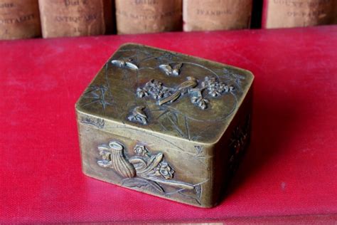 Price guide for A Japanese bronze box and cover, 